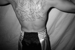 Boxer shows off back tattoo of eagle at (FNT) Fight Series by Canaan Albright